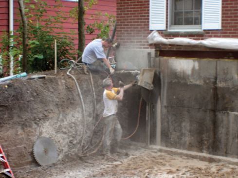 A day of excavating and grading left a flat, accessible site for the concrete-cutting subs.