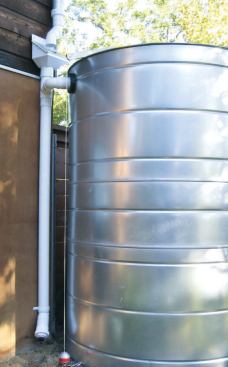 A custom steel tank with a rain head and a tall diverter pipe.