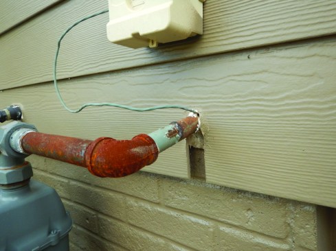 This detail looks bad and makes the wall vulnerable to air and water leaks.