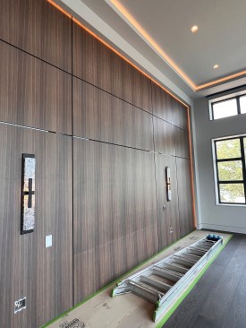 Here the lights are used to outline wall panels beneath the tray ceiling in this bedroom.