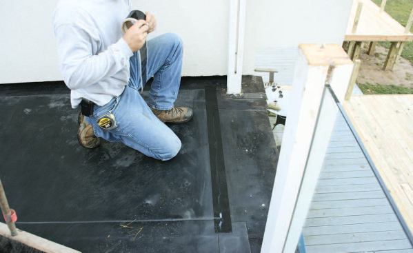 Self-adhering EPDM tape was used at the seams and to seal the membrane to the sidewalls and deck posts.