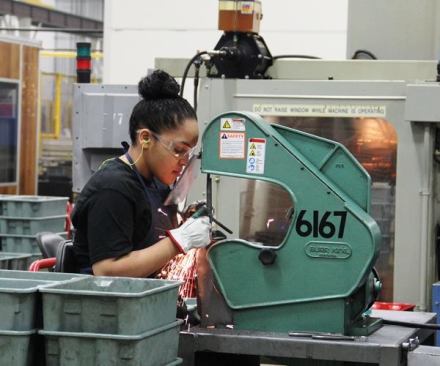 While much of the work done in this factory is performed by automated machines, some tasks are best performed by humans. Here a worker smooths a part of a piece the machine couldn't get 
(
click here for video
).