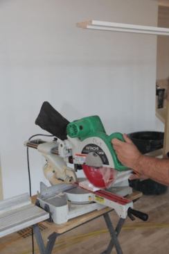 Zoomed in half way, the focus is more on the sawing, but the vertical orientation lets me see the other end of the jamb.