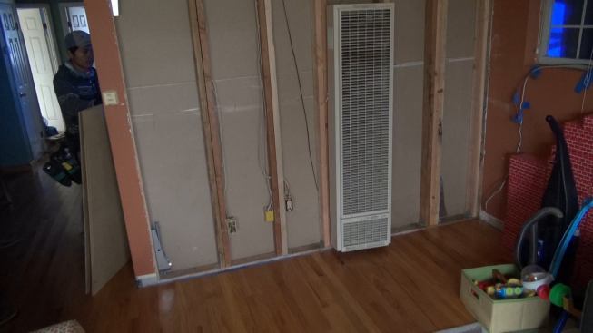 This is one of two shearwalls running across the width of the house. Gregor was able to achieve the strength he needed by doubling up the studs in the existing partition walls, and installing hold-downs connected to the new strip footings installed beneath the walls.