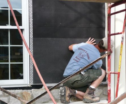 Metal lath is installed on top of Grade D paper in preparation for stucco.