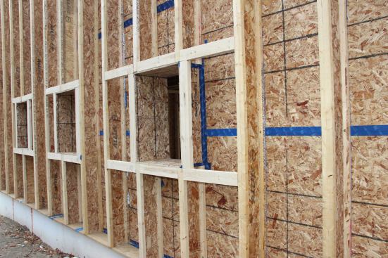 Another view of the completed window bucks, showing the ProClima Tescon VANA tape used for air-sealing the OSB skin and the window buck joints.