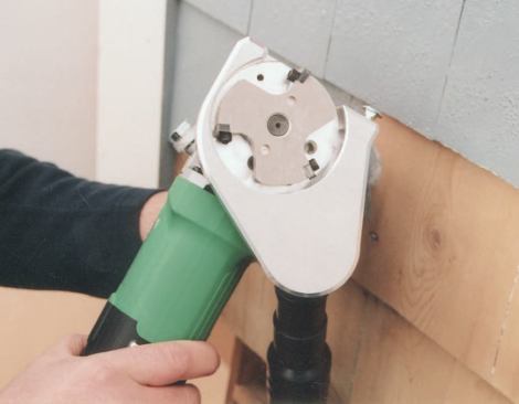 The Paint Shaver grinds off paint but captures almost all of it in an attached vacuum.