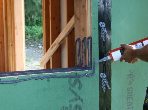 …and finishing at the other. We used one 29 oz. cartridge to complete the sill pan on this 5-foot wide window—framed in a 2x6 wall with 1.5-inch-thick ZIP System R-Sheathing panels.