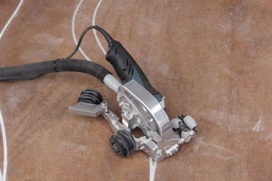 This unusual grinder-based tool—the Engrave-A-Crete
Spiider—is used to cut decorative patterns in concrete. Save your pennies, though, it goes for about $1,500.