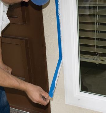 With a flush window, applying painter's tape to the wall and window fin gives the sealant a straight edge and speeds cleanup.