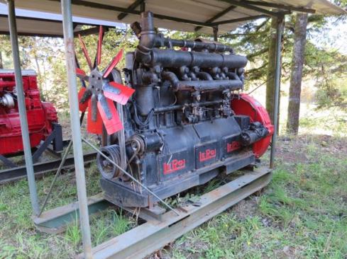 Stationary engines, like this one from Le Roi, were used to power generators, pumps, and even small saw mills. The engine was bolted to skids and hauled to where it needed to be. At that point the machine to be powered was connected by belt to a flywheel or pulley on the back of the engine. This engine was manufactured in Milwaukee and is missing a radiator and perhaps a housing. Le Roi started making engines in 1913 and was in business until the late 1950s.