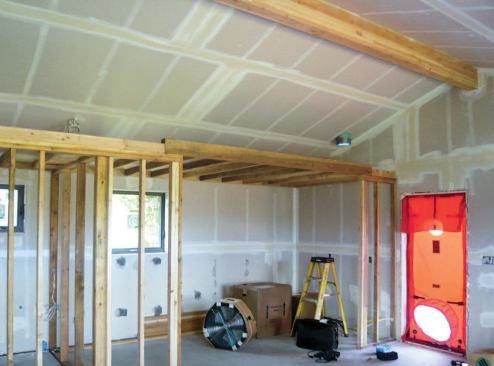 A drop ceiling above interior partition walls provided space for the ERV and associated ductwork.