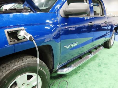 Via Motors turns new trucks and vans into plug-in hybrids. The vehicle is powered by an electric motor connected to batteries, which can be charged with household current or the engine. The batteries are installed under the bed; the transmission is removed because it isn’t needed. Under battery power alone, the truck has a range of 40 miles. When the batteries get low a small 2.0 to 2.4 liter engine kicks comes on to drive the generator used to recharge them. The motor is not connected to the drivetrain; it only powers the generator. Total range (electric + gas) is said to be 350 miles. Price: about $90k.