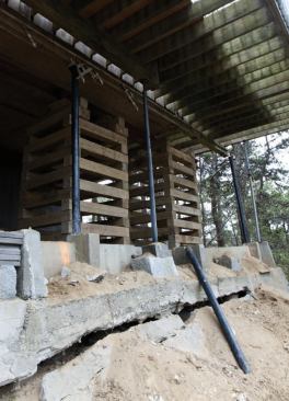 A narrow foundation cut into the hillside carried only about a third of this home’s floor span. The downhill portion was built over a grade beam that was gradually moving downhill.