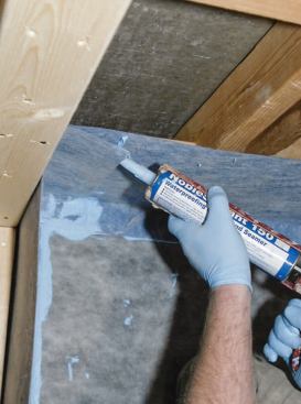 After sealing the overlap in the corner, I worked back around the perimeter with the caulk gun.
