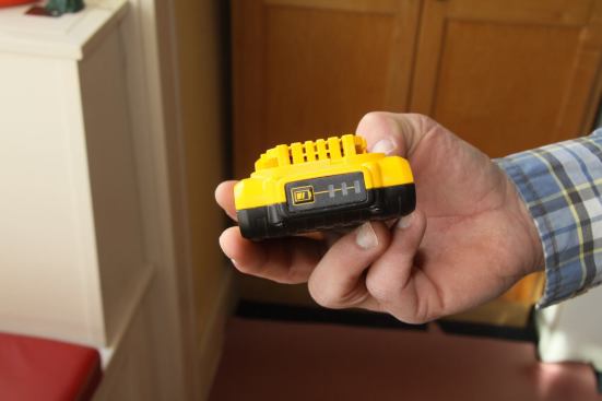 The built-in battery gauge shows four levels: Three lights = 75-100% charged; Two light = 51-74% charged; One light = < 50% charged; No lights = pack is empty.