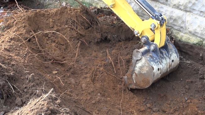 Fortunately, the existing soil under the block wall is consolidated sandy soil with a good bearing strength, allowing a 16-inch spread footing to easily do the work of supporting the existing block foundation as well as the new framing load to be installed above it.