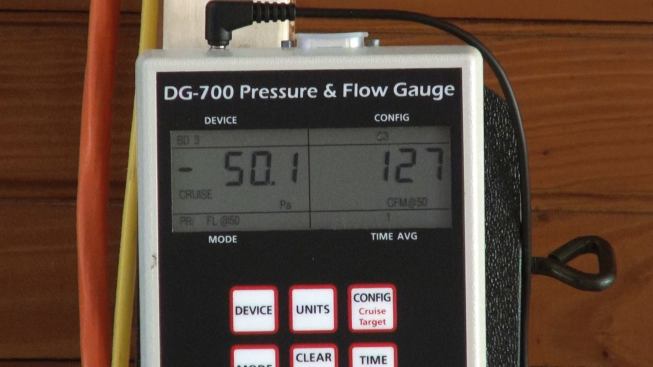 The preliminary reading, before additional air-tightening and sealing: 127 CFM at 50 pascals depressurization.