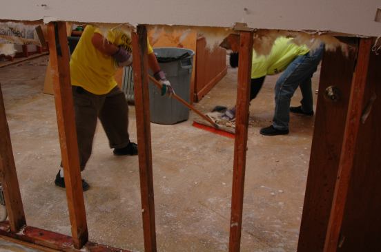 Wet fiberglass insulation in the wall is also removed.