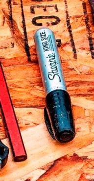 Sharpie Marker I bought these extra-large Sharpies the last time I was at Lowes. It is supposed to work on wet wood, but it doesn’t do that well. But it works fine on dry surfaces and I use it to detail plates and write on wood or house wrap. I frequently write measurements on the wall where they can be seen from the cut station.