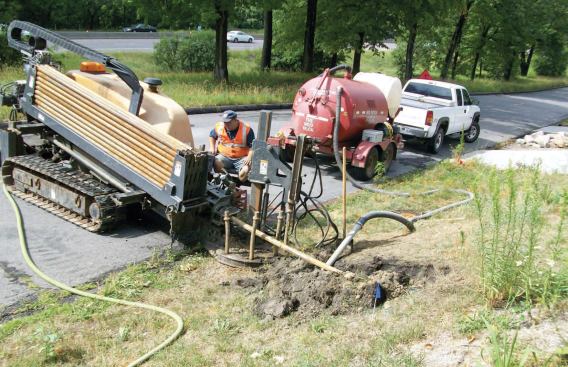 Horizontal boring to install drainage pipe proved a more cost-effective alternative to digging a trench, which would have entailed much greater damage to the landscaping.