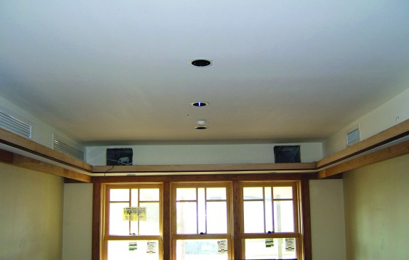 To reduce duct leakage to the outside, run ductwork inside conditioned space, through ceilings or (as shown here) through interior soffits. Photo: Clayton DeKorne