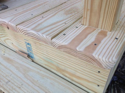 For this simple set of exterior steps, the budget was tight, but the author was still able to incorporate several principles to prolong its life. A gap between each step and riser allows water to drain and the wood to dry freely. In addition, the deck boards are installed with the growth rings curving down (bark-side up). The author believes this is the best way to ensure that pressure-treated deck boards that cup will drain water rather than hold it (see discussion of why below).