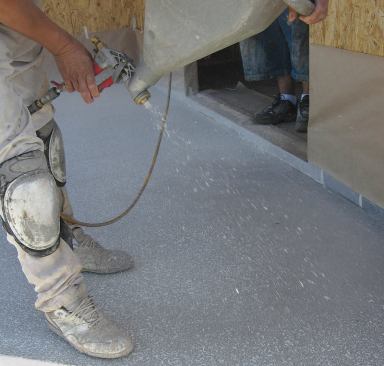 After the second layer of polymer cement cures, the deck can be finished — in this case with a spray-applied texture.