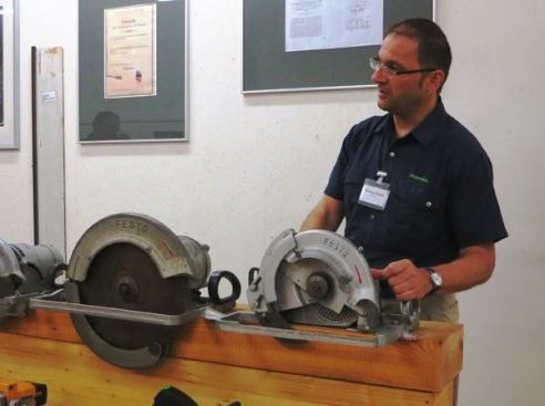 According to our tour guide, Festo saws did not always have riving knives. A riving knife was added at a time when the company wanted to export saws to Switzerland—which had strict regulations regarding the safety of saws. Since that time riving knives have become standard in Europe.