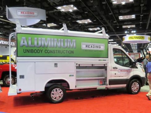 This Ford Transit 250 is equipped with a Reading Classic Service Van Body. Made from welded aluminum, it is said to be half the weight of a steel body—which results in greater fuel economy, payload, and life (it won’t rust like steel). Two of the side access doors are hinged; the one in front is a roll-up—as is the access door in the rear.