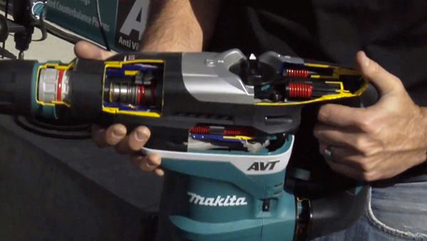 A Makita product manager uses a cut-away of the company's
HR4013C to show how the vibration dampening system works.