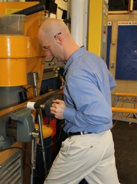 The guy with the drill is Matt Howell, the product manager for hole saws. Matt is drilling a hole in a piece of square stainless steel tube.