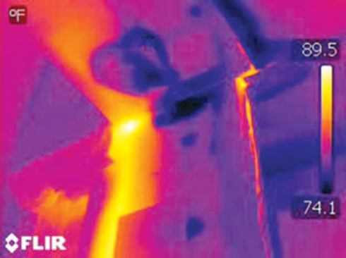 We turned on the hot water and let it run, then set the camera on time-lapse mode and began scanning. In a couple of minutes, the water began to show up as a bright yellow streak coming down the corner of the wall.