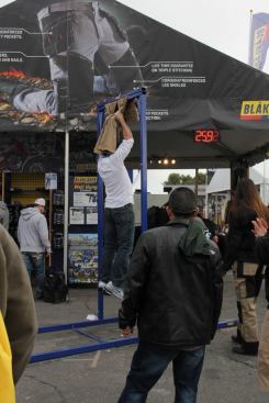 Tradesmen work on their hang time at the Blaklader booth. Hang from the company’s work pants long enough and you might win a power tool…