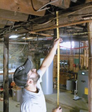 At its worst, this beam had taken on a 3/8-inch sag — not enough to worry about, and certainly not worth jacking straight, which might cause problems upstairs with door swings and cracked plaster.