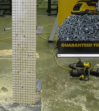 Runtime was tested by drilling 3/8-inch holes with a twist drill bit through 2-by material. There are 183 holes in this board – made by a brushed drill/driver (DCD780) equipped with a 1.5 Ah battery. The drill can be seen on the right side of the photo.