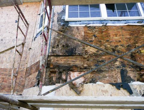 When the stucco was removed, extensive rot was discovered in both sheathing and framing.