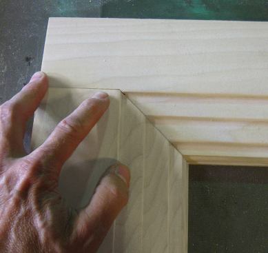 The carpenter who installed the original casing used a jack miter, a combination of a butt joint and a miter, to join the stepped casing stock.