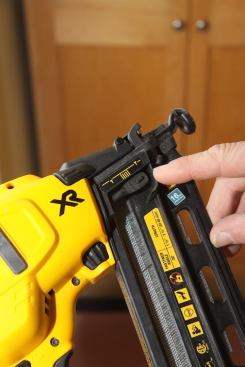 A depth adjustment dial, visible to the left of the magazine, is accessible on the right side of the tool. The depth gauge is nicely designed because it clearly shows the depth at which the tool currently is firing, allowing you to make adjustments accordingly.