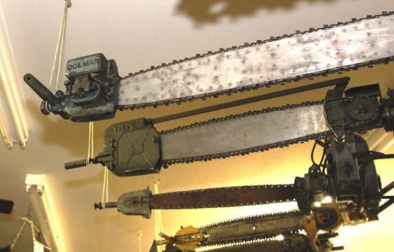 Until the mid-1940s, two-man saws were standard. Here’s a look at the outboard end of some of them. The end of the Dolmar is not just a handle; it’s an oiler too. Founded in Germany in 1927, Dolmar has been owned by Makita since 1991.