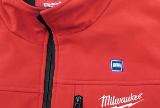 The "M12" logo on the lapel doubles as the on/off button for the heating unit. It changes color — white, red, blue — to indicate the temperature setting.