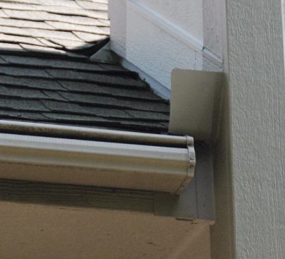 We always install diverter flashings wherever a roof intersects a wall.