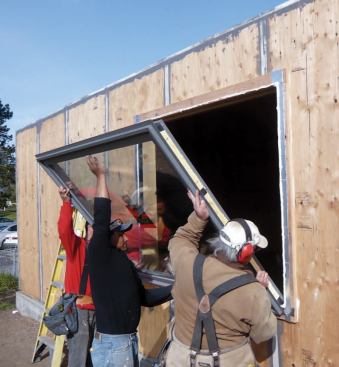 High-solar-gain glazing was used on the south elevation and low-gain glazing on the other sides; U-values range from 0.14 to 0.19.