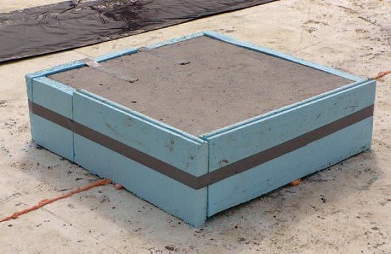 A foam wrap helps prevent the vapor barrier from tearing over rough edges. On this job, an extra layer of 2-inch foam raises the nominal R-value by 10.