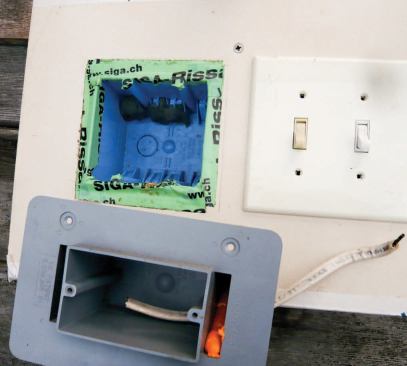 Conventional plastic electrical boxes can be sealed to partitions by sticking a strip of tape against each of the inner walls of the box and folding the portion that extends beyond it against the drywall. The width of the flange has been sized to fit under a oversized outlet cover, or "goof plate." The manufactured airtight box below is easier to seal but expensive; for economy, the author uses this type of box mostly on outside walls.