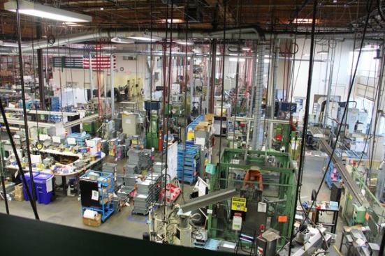 This end of the plant contains an assembly area and some industrial robots. 
Click here for a video of the action. There are very few people on the floor because this was shot during lunch break.