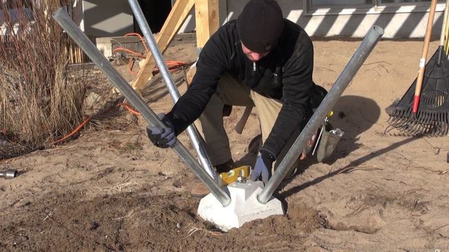 Setting the steel pins into the holes on the Diamond Pier hub provides leverage that makes it easier to carry and set the hub or to adjust its position.