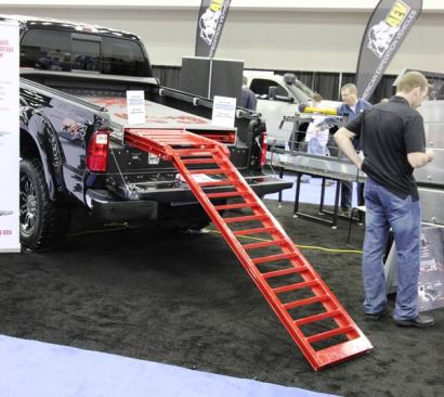 Cargo Ease will soon release the Ramp Slide, folding aluminium ramps that pull out from a housing in the bed of a truck. They can be used to load 4-wheelers, mowers, and anything else that can be coaxed up an incline. The short inner section extends past the tailgate while the long outer one pivots down to the ground. This 250-pound unit installs without drilling and can be placed in the bed or on top of a storage locker. The Ramp Slide is produced in Ontario, Canada, and is so new, pricing is not yet available.