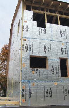 The second layer installs horizontally, overlapping in an alternating weave at building corners.