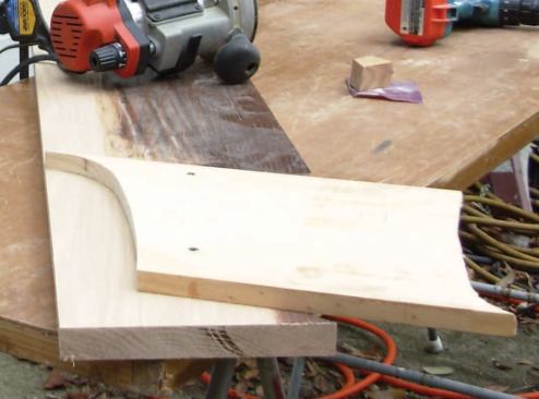 Rout the Return: I orient my pattern parallel with the grain and attach it with two screws.